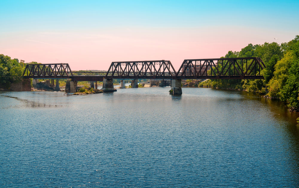 Winslow river and bridge near vehicle storage in Fairfield